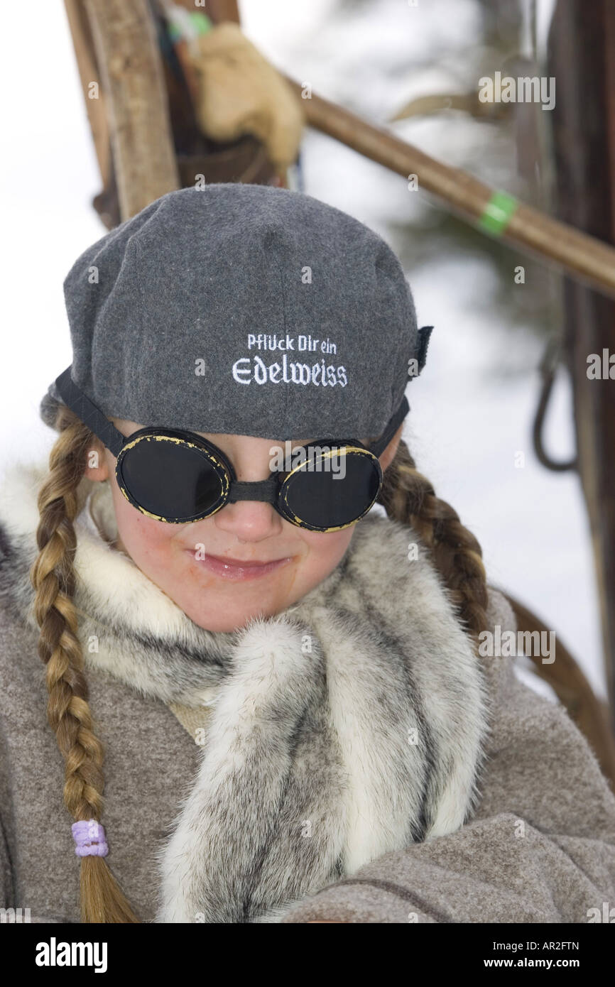 small girl skiing with old-fashioned cap and sun glasses, Austria Stock Photo