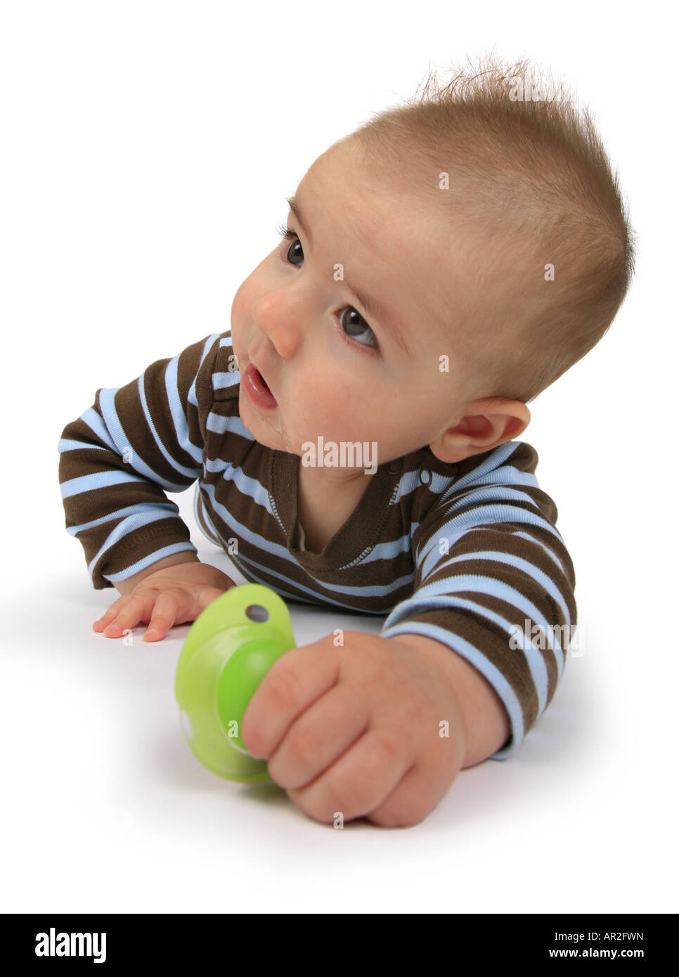 baby with comforter lying on its belly Stock Photo Alamy