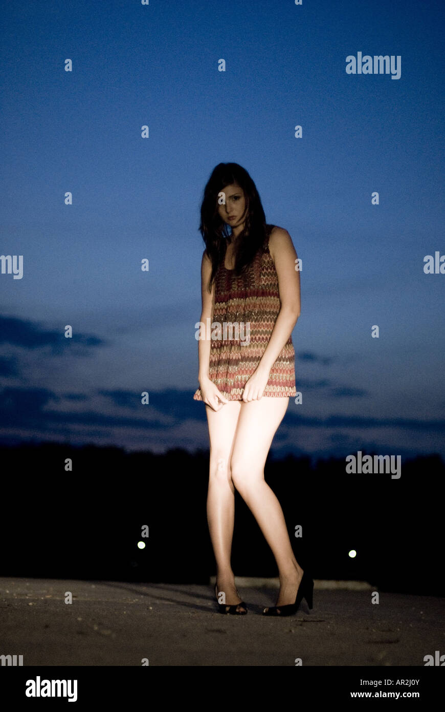 young woman lighted by spot light Stock Photo