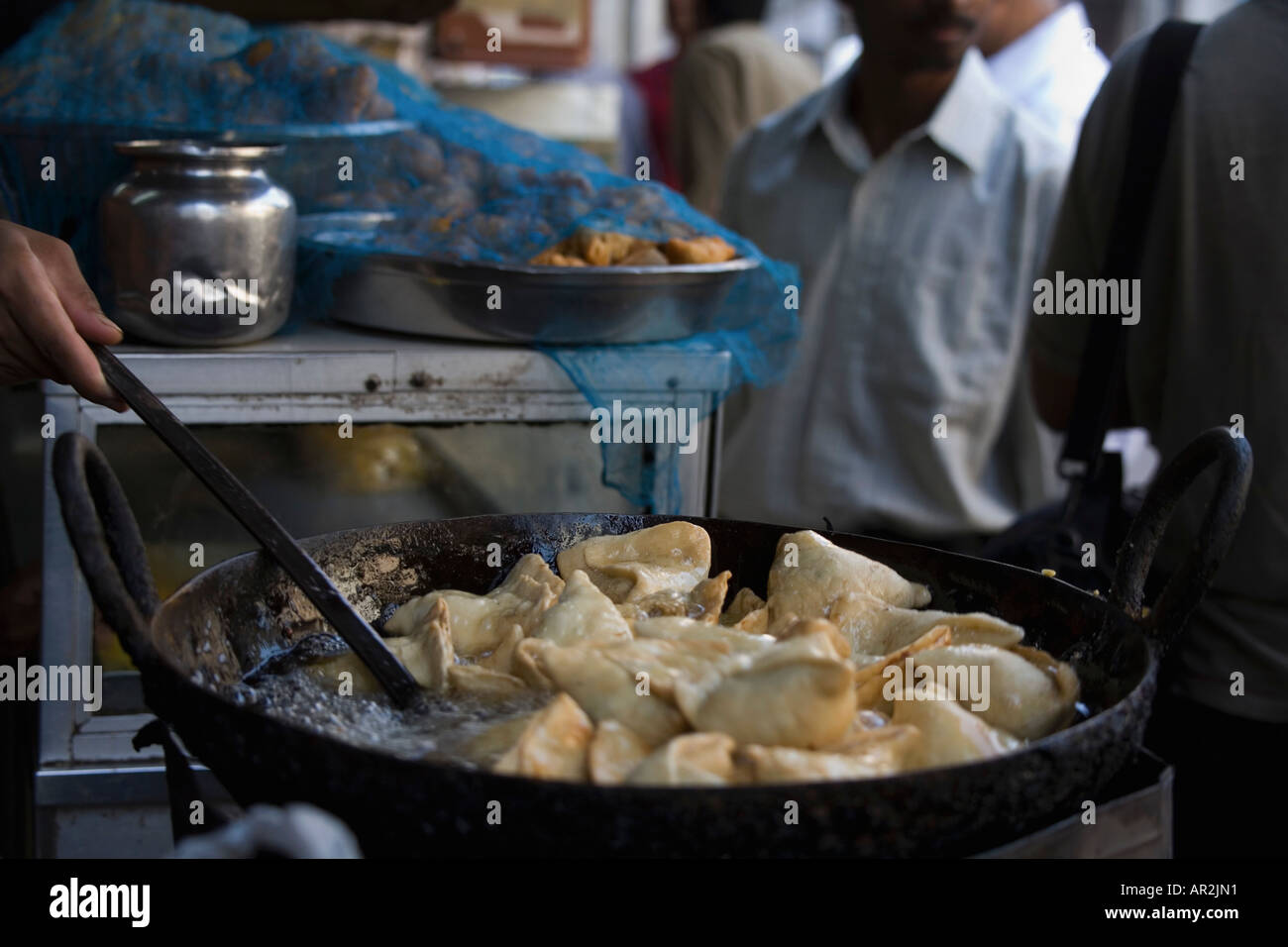 Market vendor cooking samosa Stock Photo