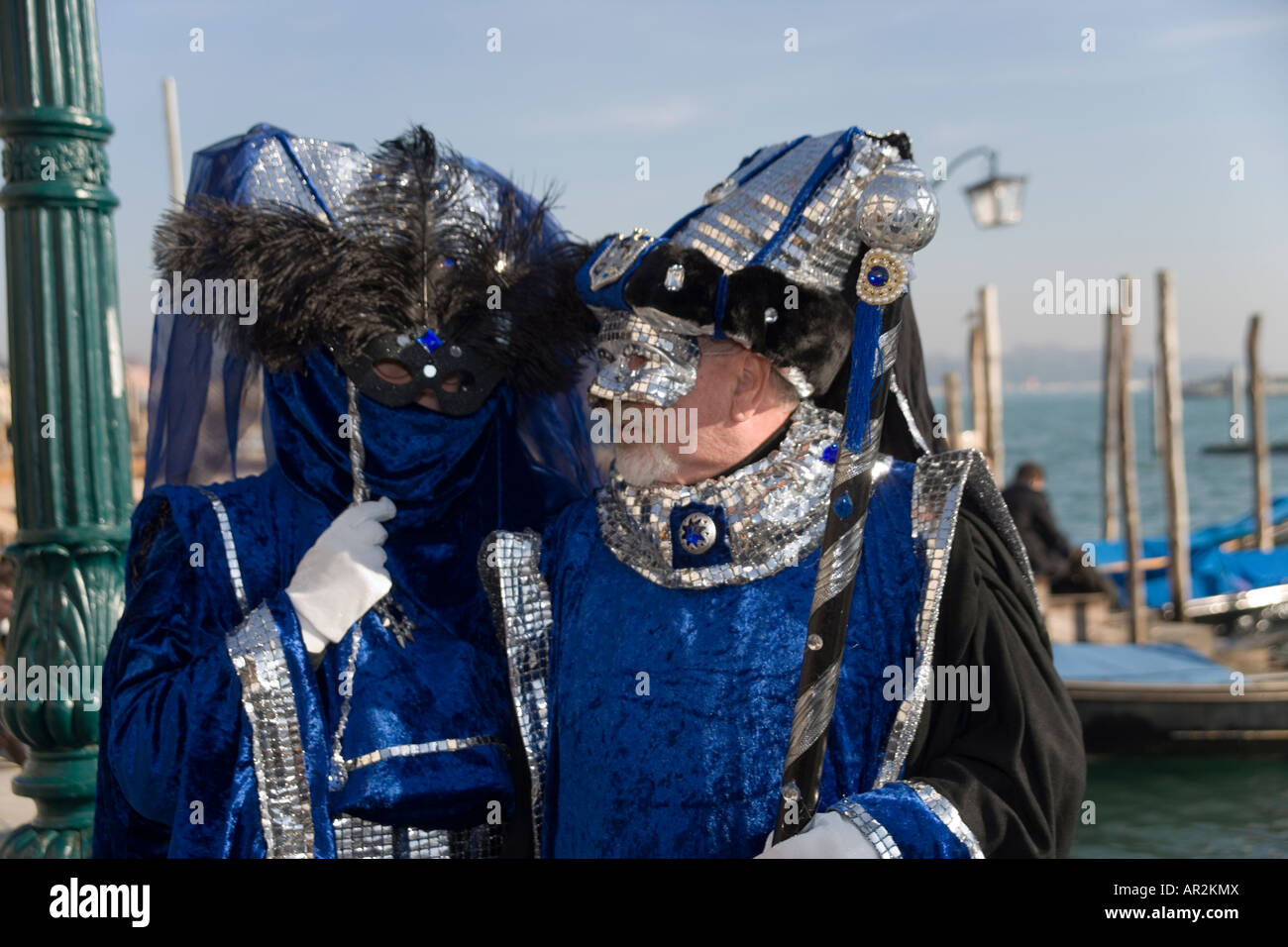 Revellers in mask and costume at the Venice carnival with the St mark's ...