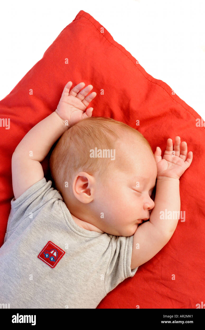 Baby boy sleeping on cushion Stock Photo Alamy