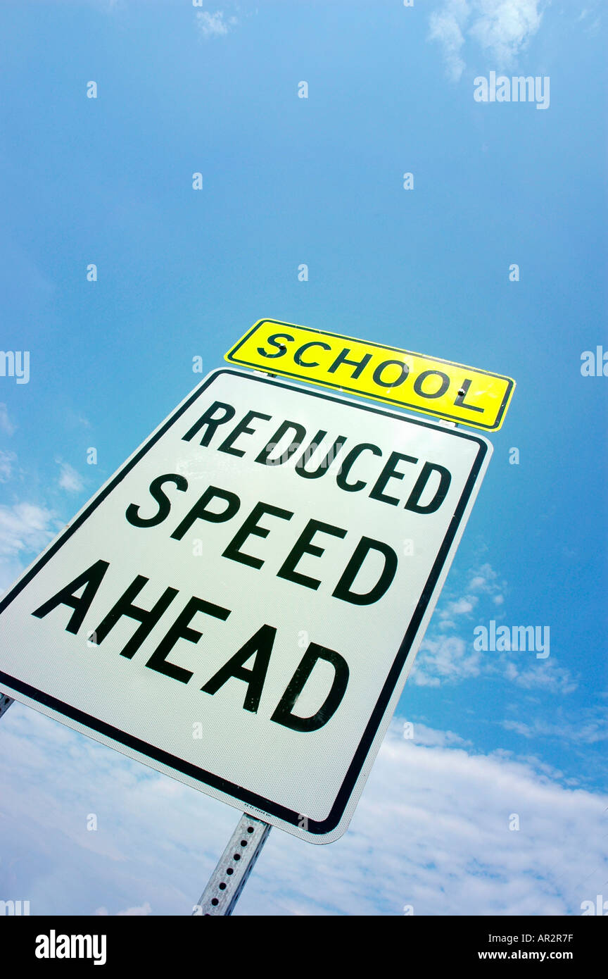 School Sign reduced speed ahead warning Stock Photo Alamy