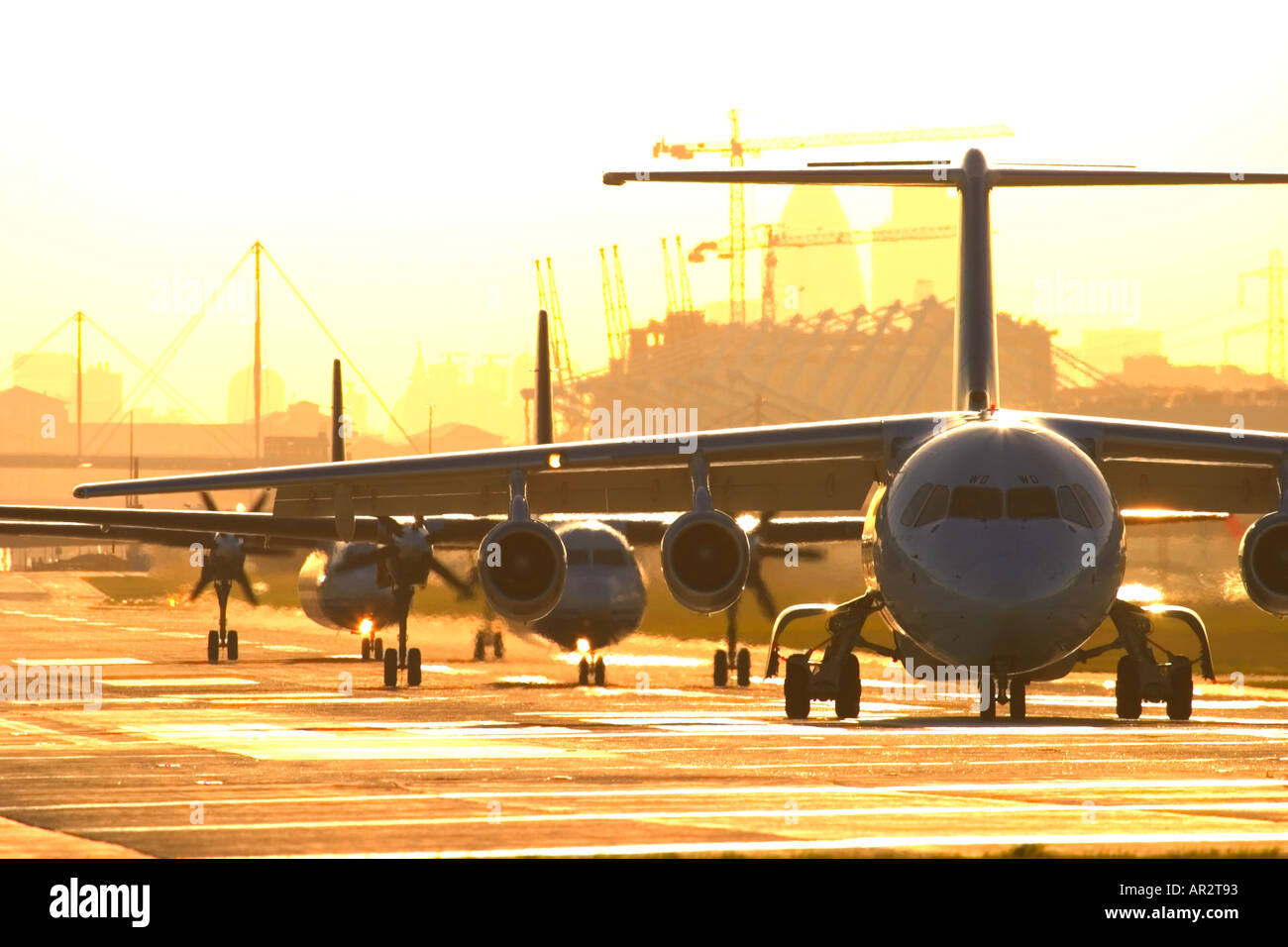 Airplanes in a queue for take off at London City airport Stock Photo