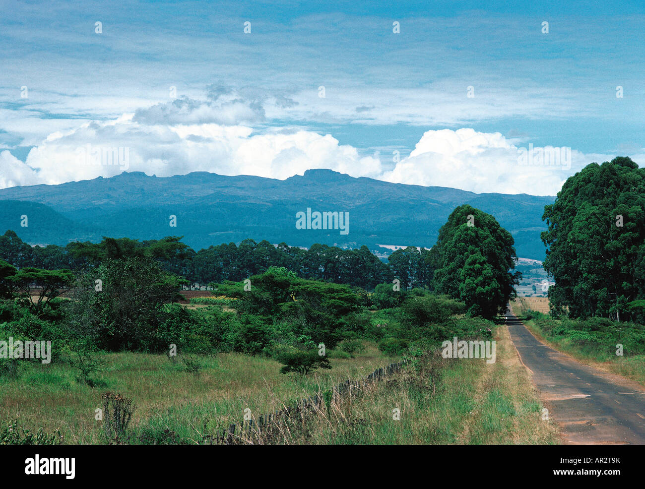 Mount Elgon 14 178 ft and the tarmac road with potholes towards the mountain from Kitale in Western Kenya East Africa Stock Photo