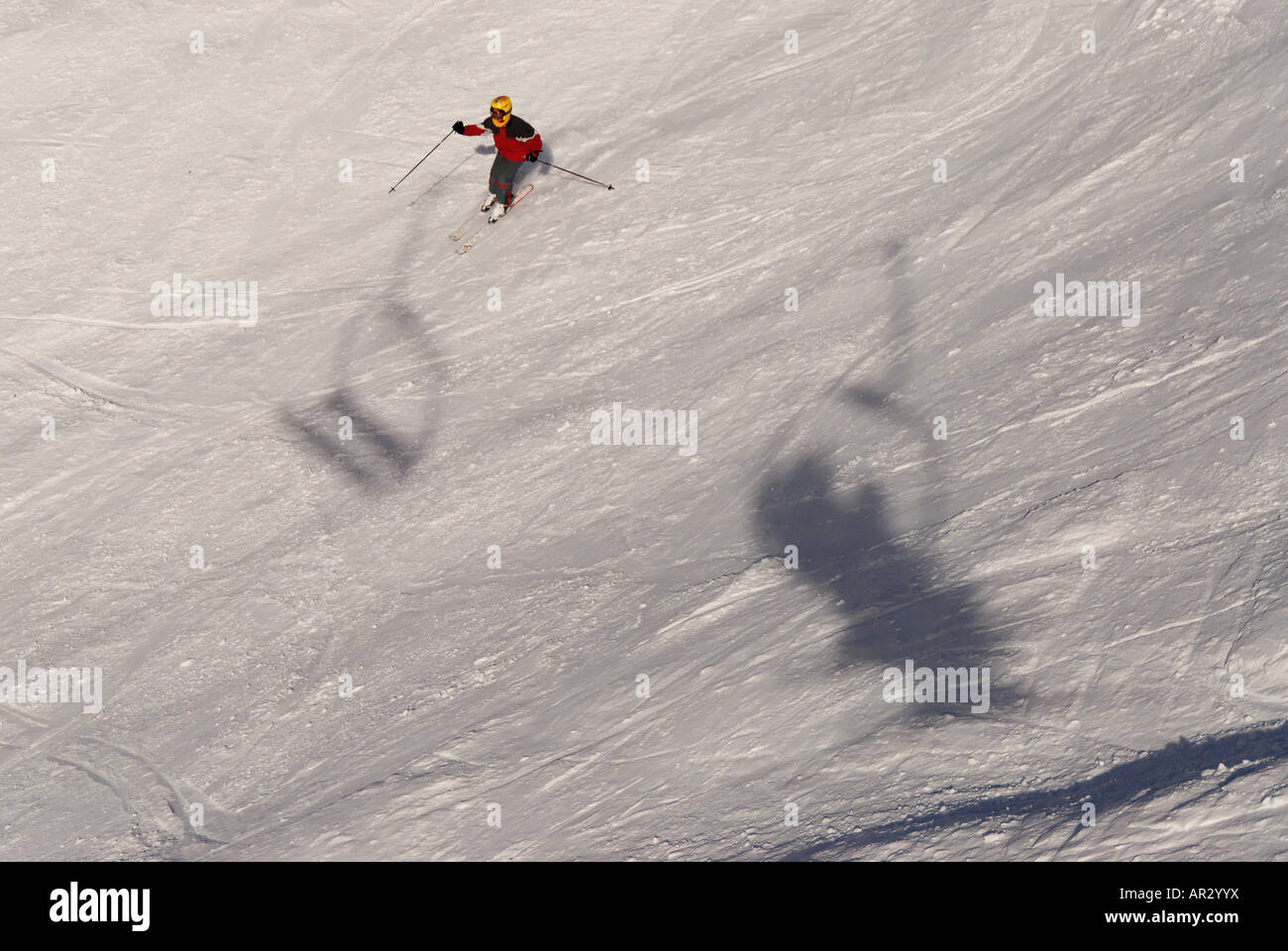 Downhill skiing in the french alps with a chair lift in the shot Stock