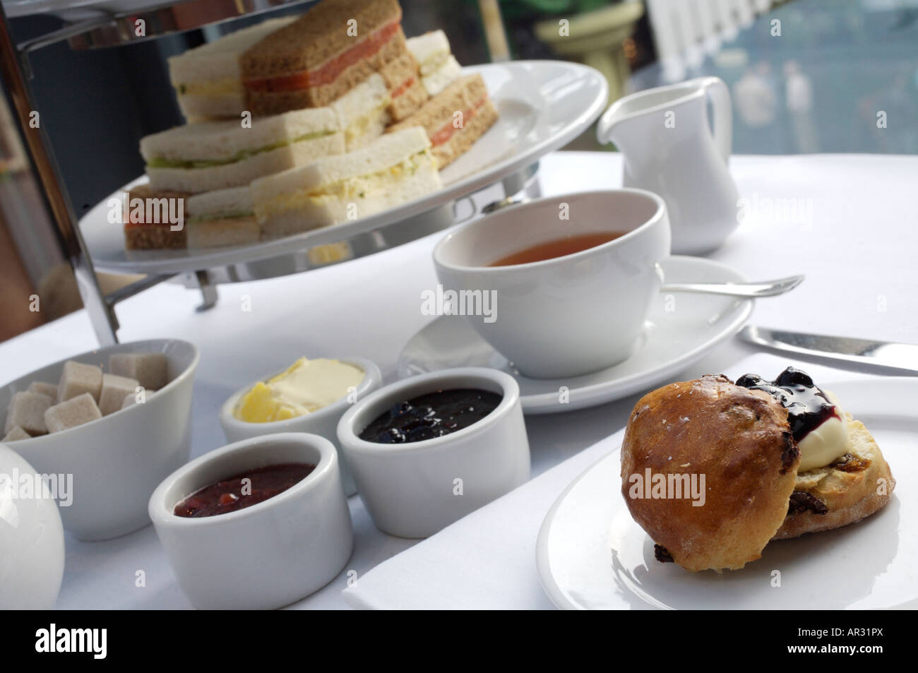 English afternoon tea service with finger sandwiches berry preserves ...