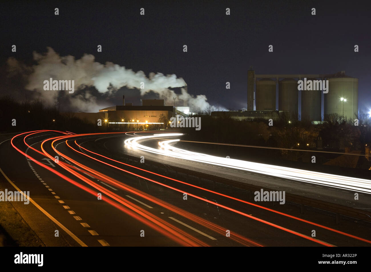 A14 road at Bury St Edmunds at night with the sugar factory in background in the UK Stock Photo