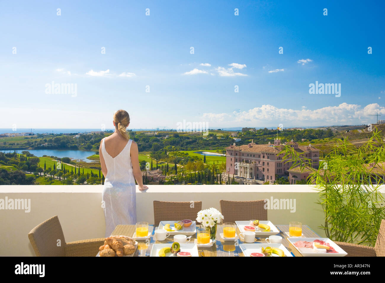 Curated visual reference: Fresh Look at Young Woman On Balcony Apartment Hi Res Stock Photography And
