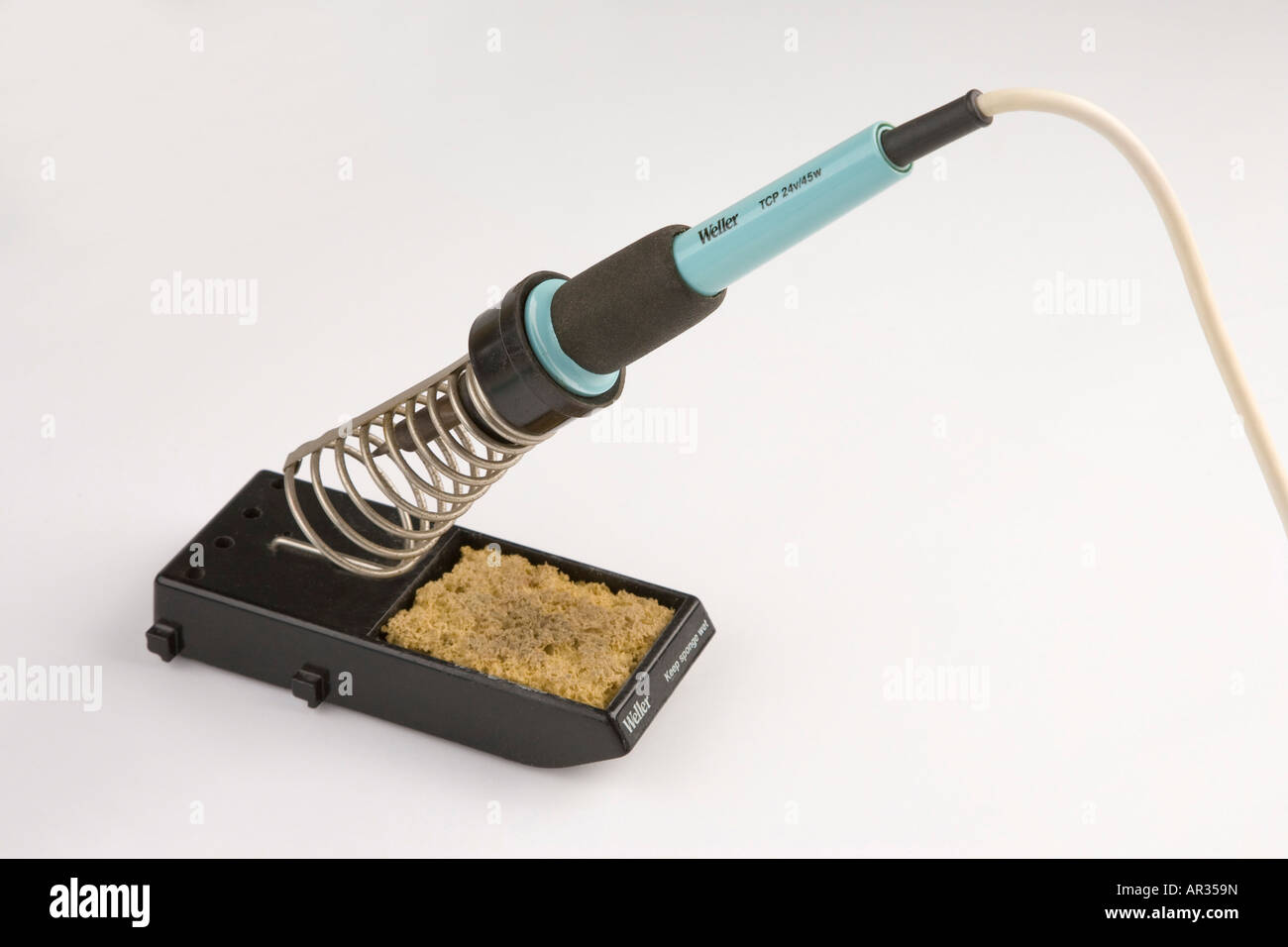 soldering iron tool in stand Stock Photo Alamy