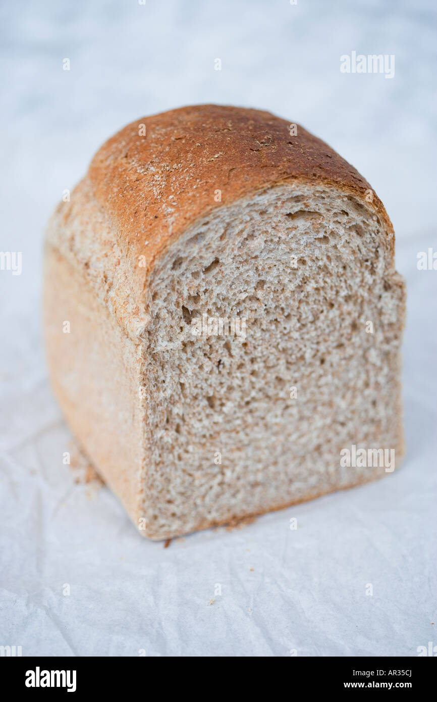 Wholemeal uncut loaf of bread Stock Photo Alamy