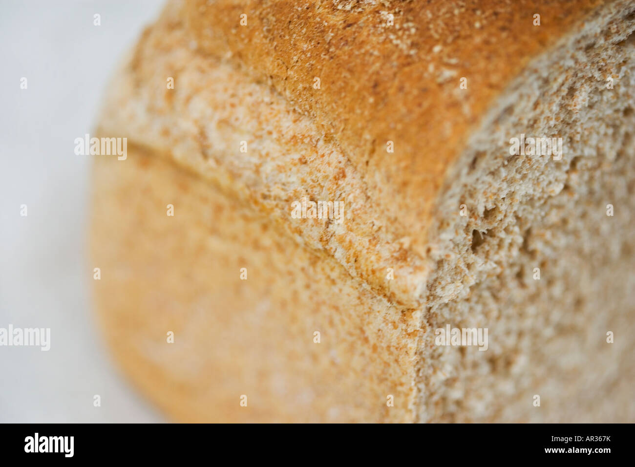 Wholemeal uncut loaf of bread Stock Photo Alamy