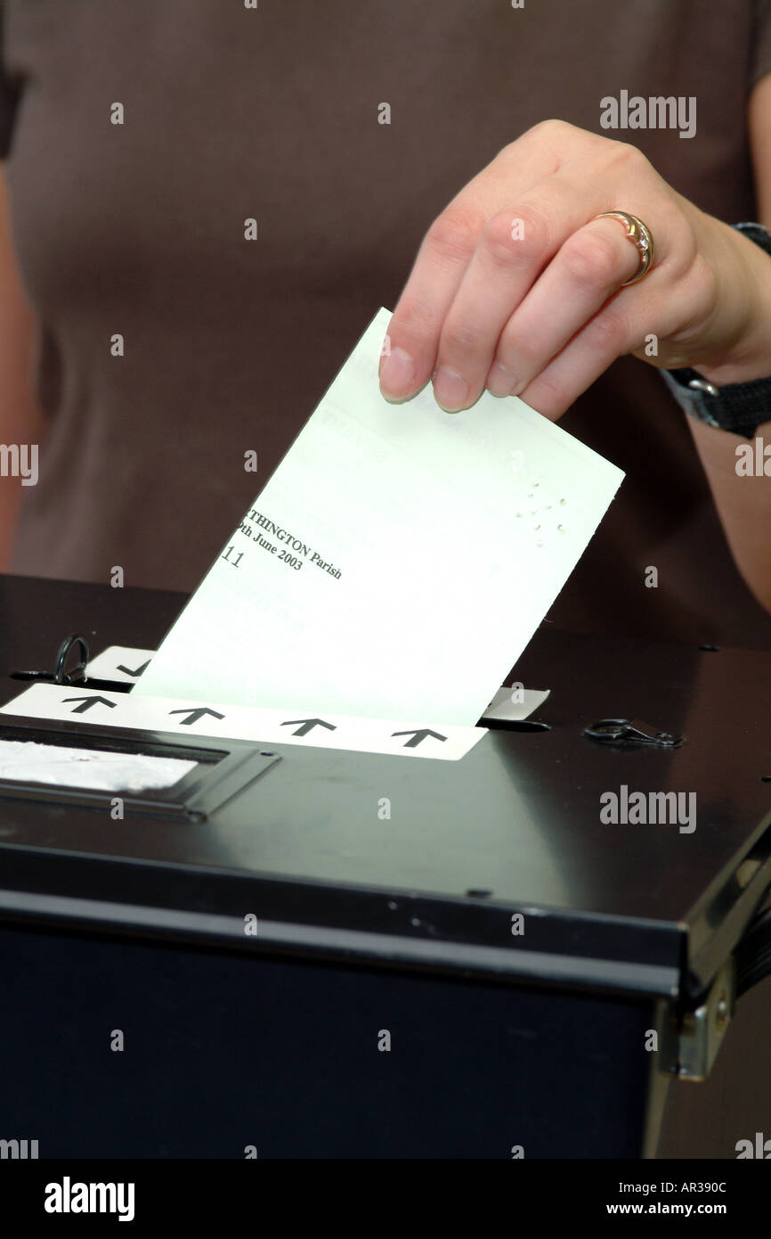 Ballot Box Voting Paper Votes for women Holds voting paper Voter Stock Photo