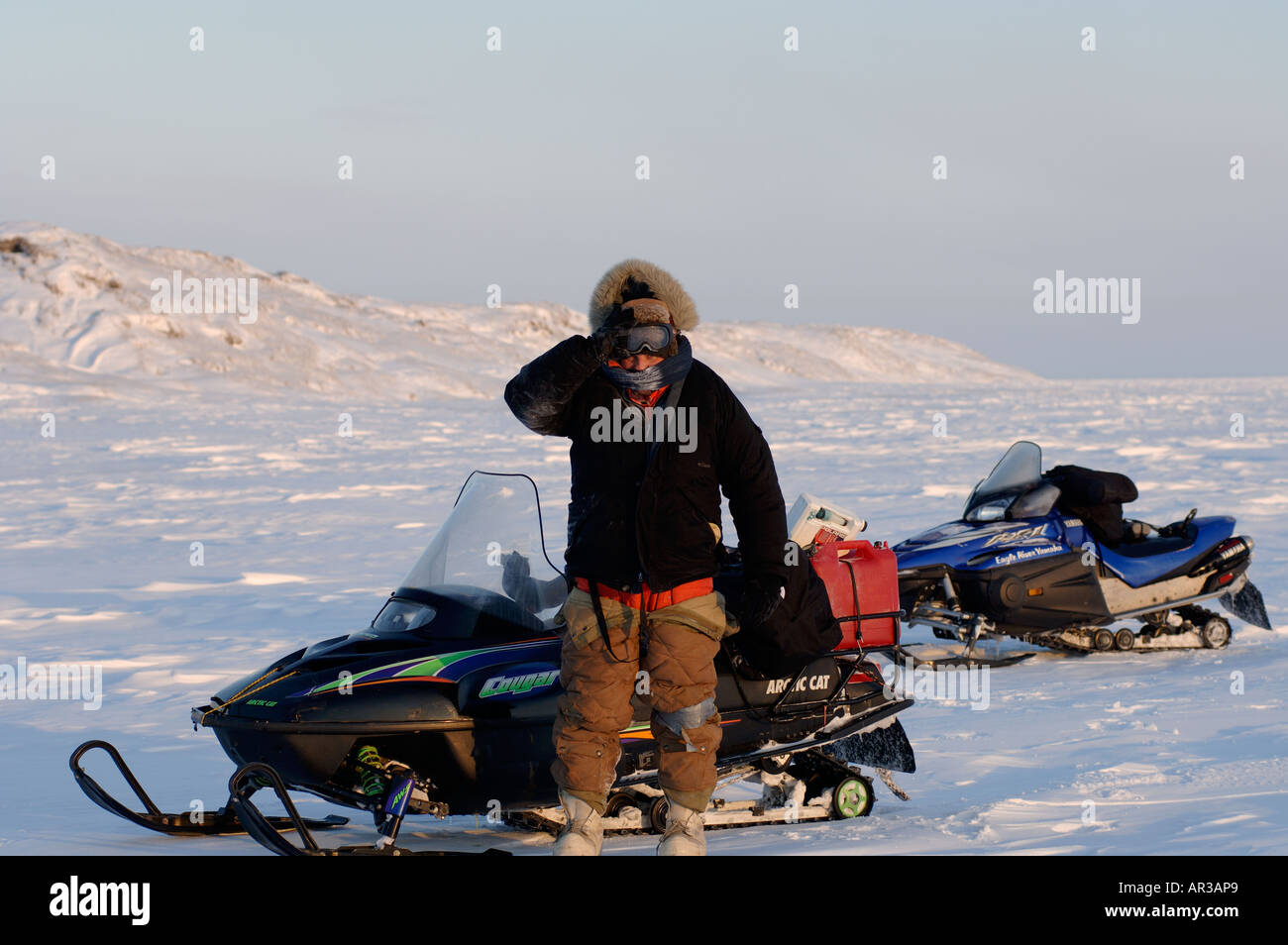 photographer Steven Kazlowski with snow machines Arctic National
