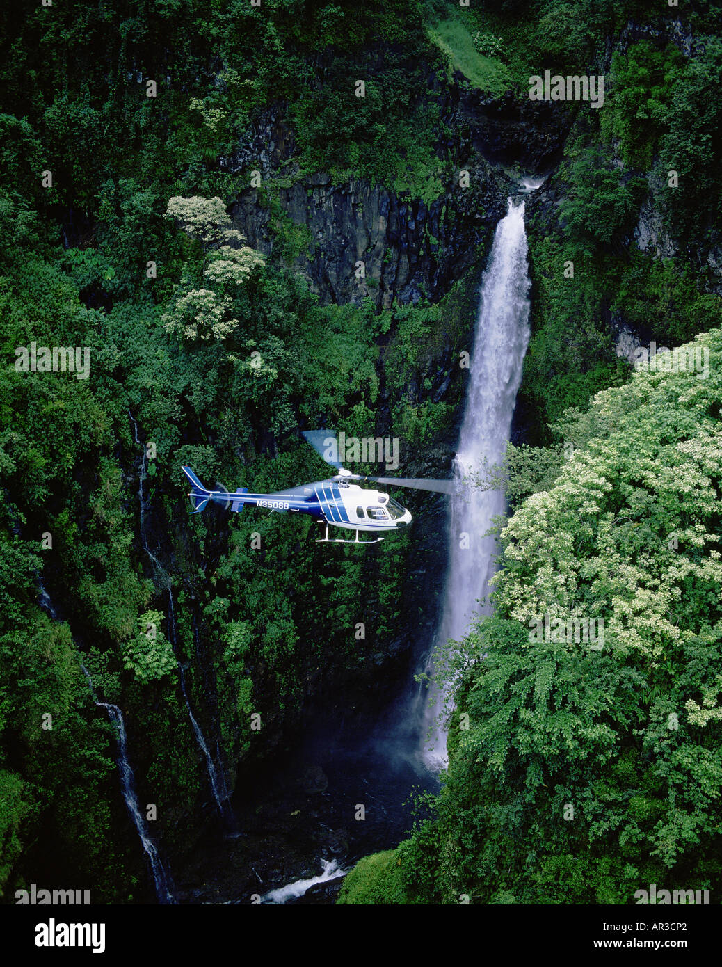 Helicopter at waterfall Stock Photo