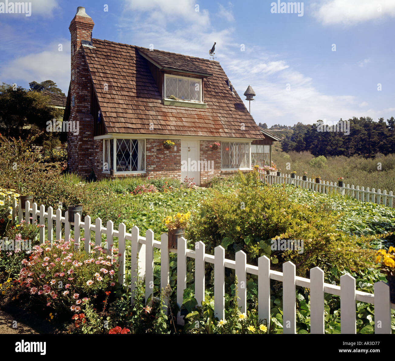 quaint cottage picket fence Carmel California USA Stock Photo