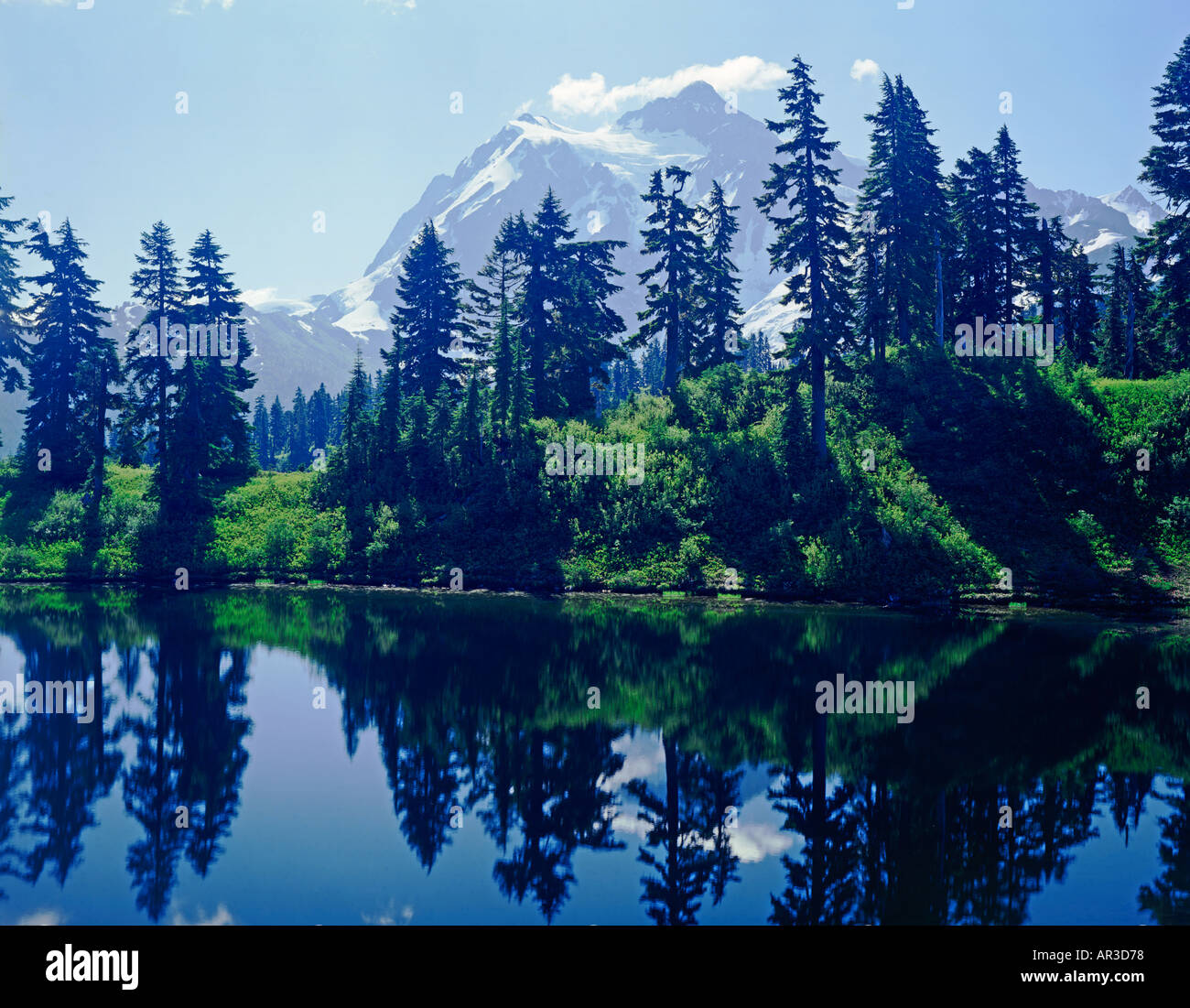Mount Shuksan in the North Cascades National Park of Washington State USA reflected in Picture Lake Stock Photo