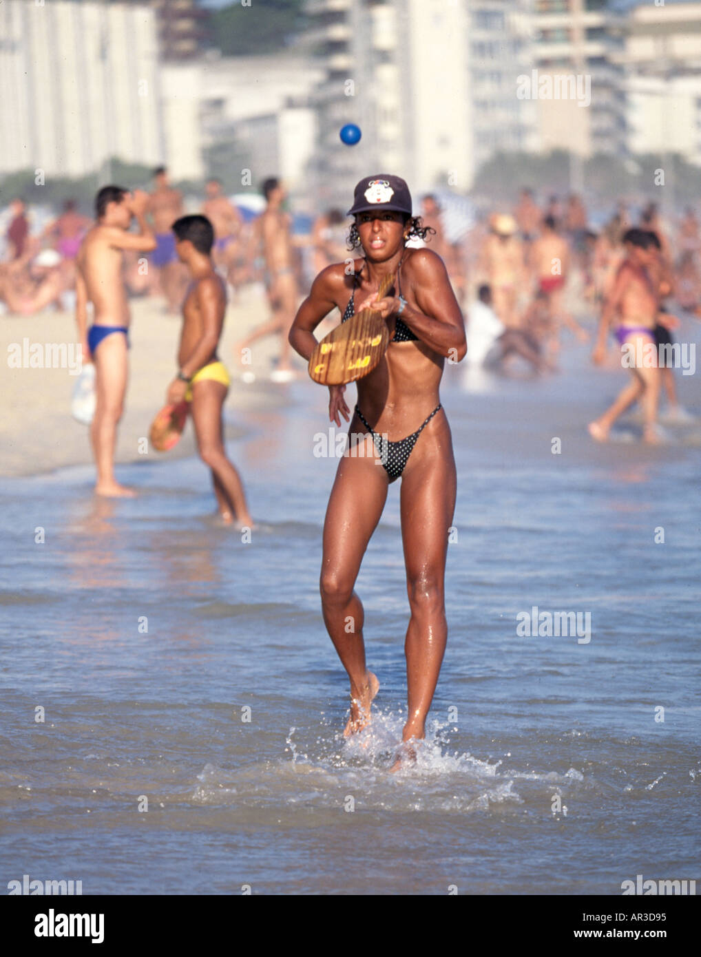 A skinny woman plays paddleball on Copacabana beach in Rio de Janeiro Brazil  Stock Photo - Alamy