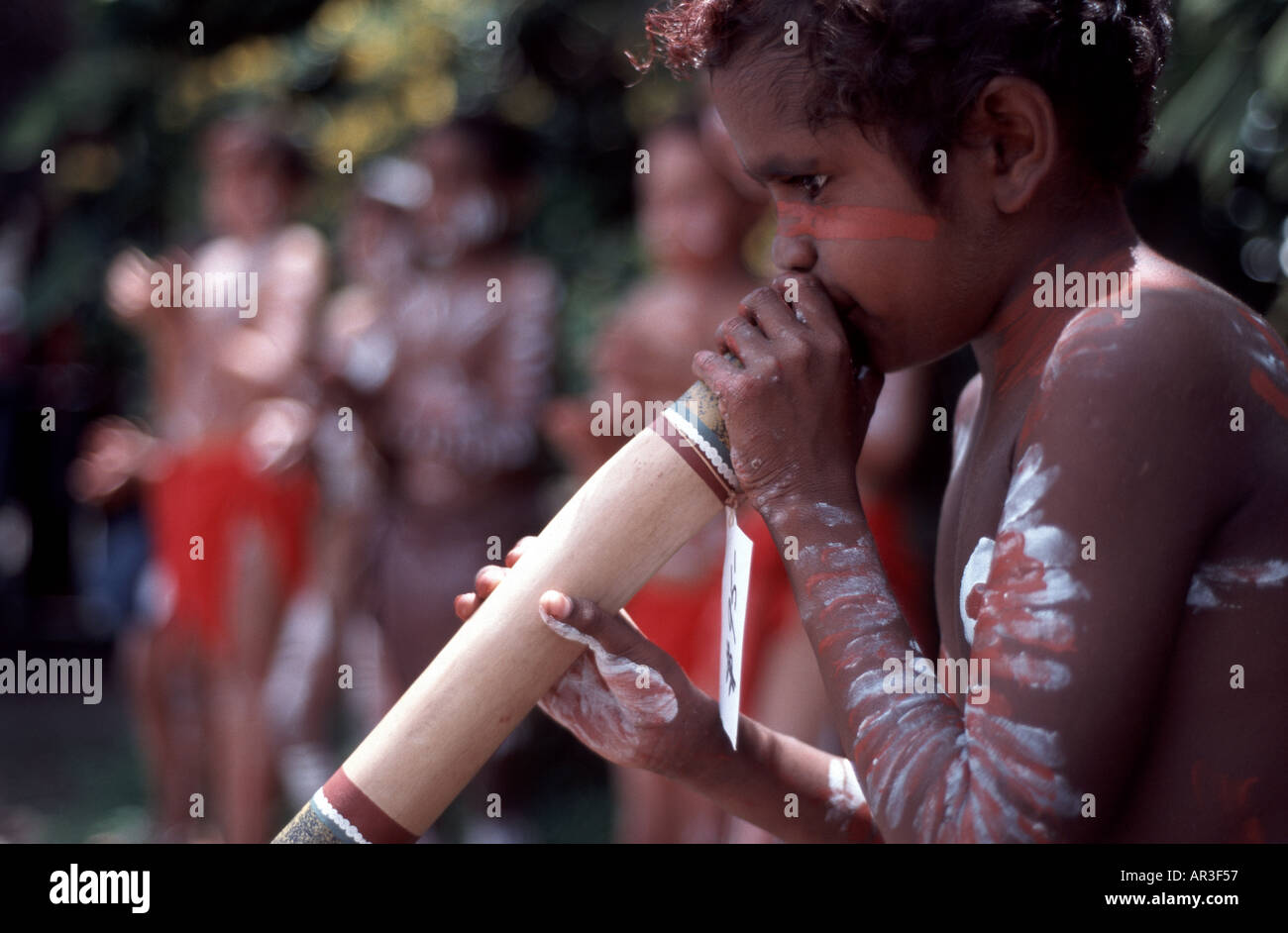 Australian aboriginal boy playing didgeridoo Stock Photo Alamy