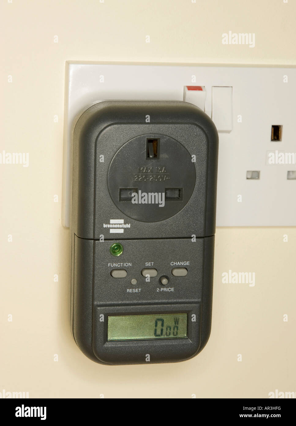 digital energy meter in wall socket to measure electricity consumed by