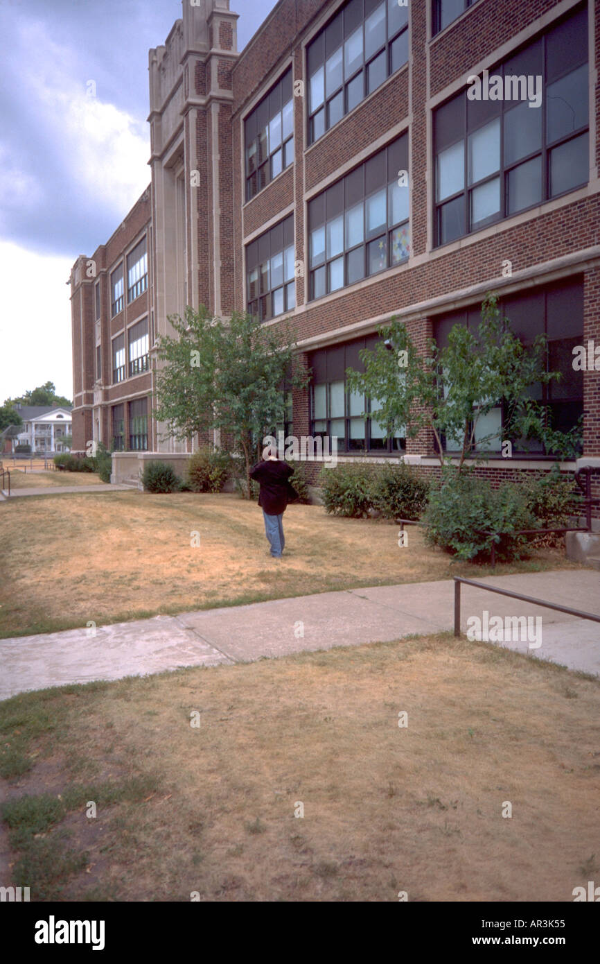 Girl age 12 in front of ster Elementary School. St Paul Minnesota
