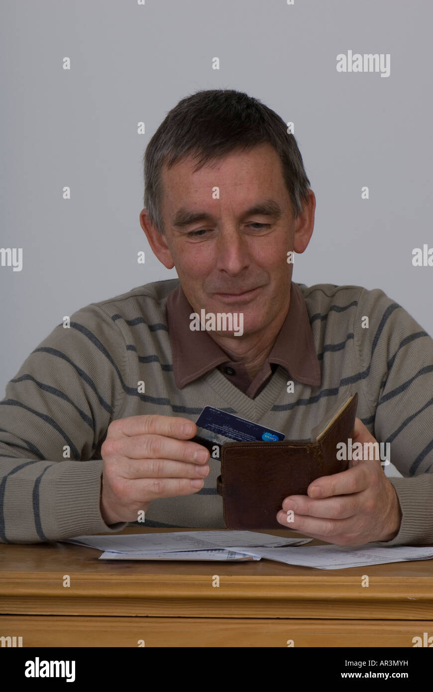 money worries mature male stressing over debt problems Stock Photo