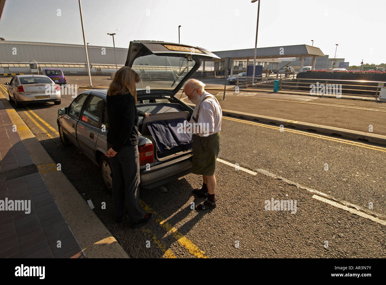 BAA London Heathrow Airport T4 arriving at drop off point - 2 people ...