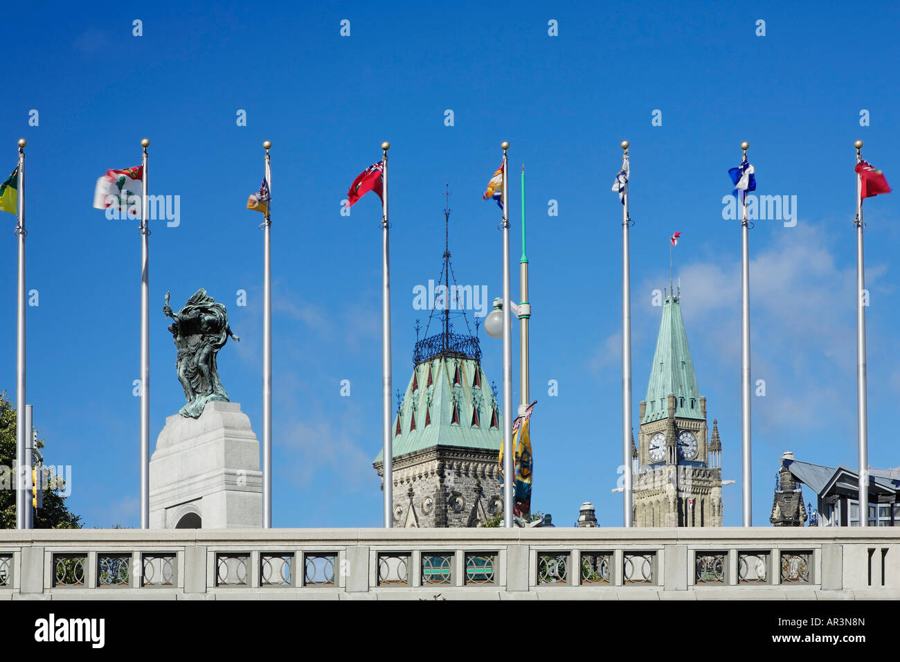 Parliament Hill sits in the backdrop of flags in Ottawa Parliament Hill
