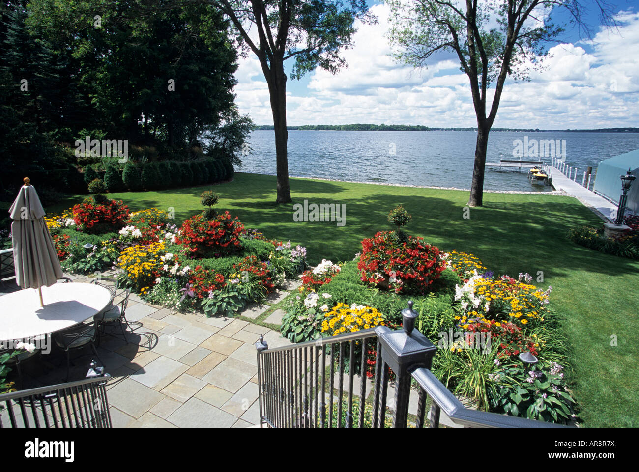 VIEW FROM BACK PATIO STAIRS OF MINNESOTA LAKE HOME, WITH PERENNIAL