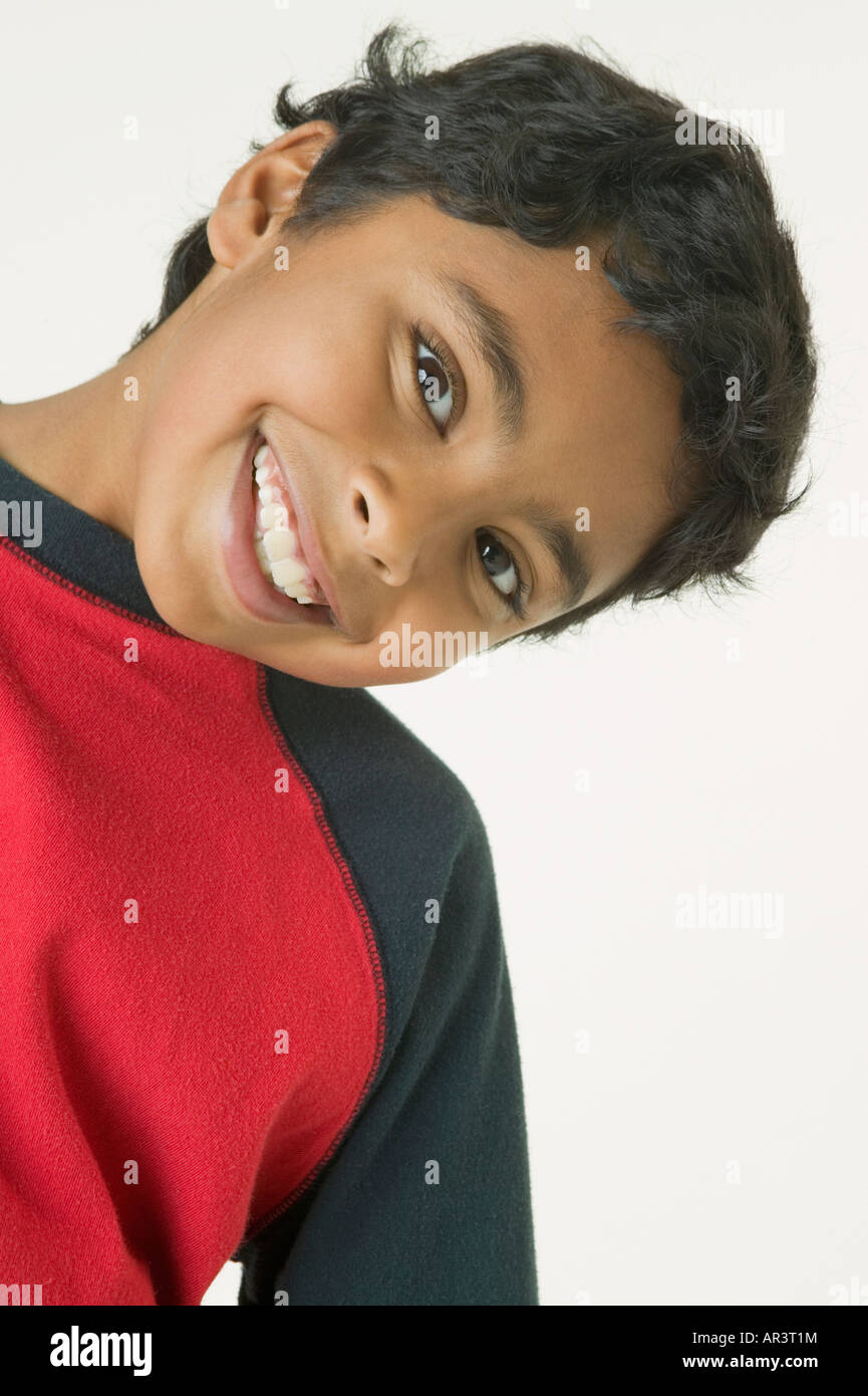 Indian boy bending head to side Stock Photo