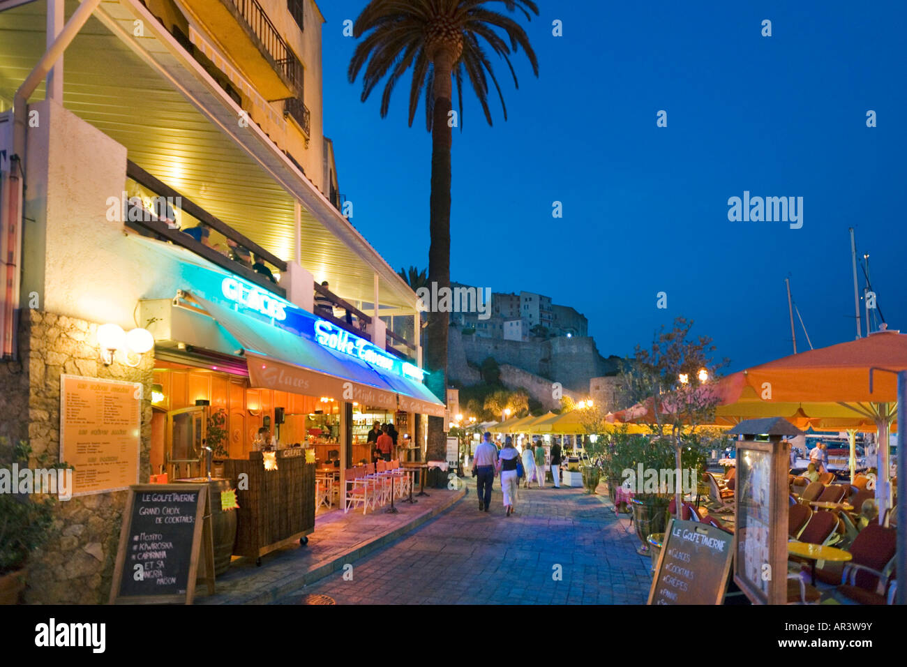 Cafe bar on Quai Landry with the Citadelle behind, Harbourfront, Calvi