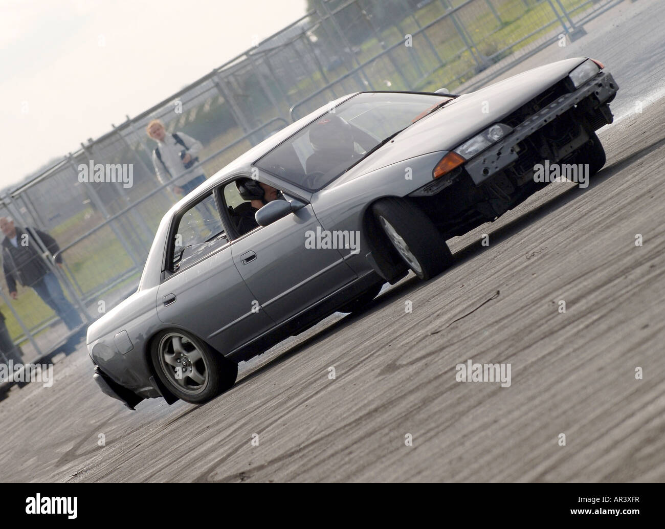 Drifting a rear wheel drive car Stock Photo Alamy