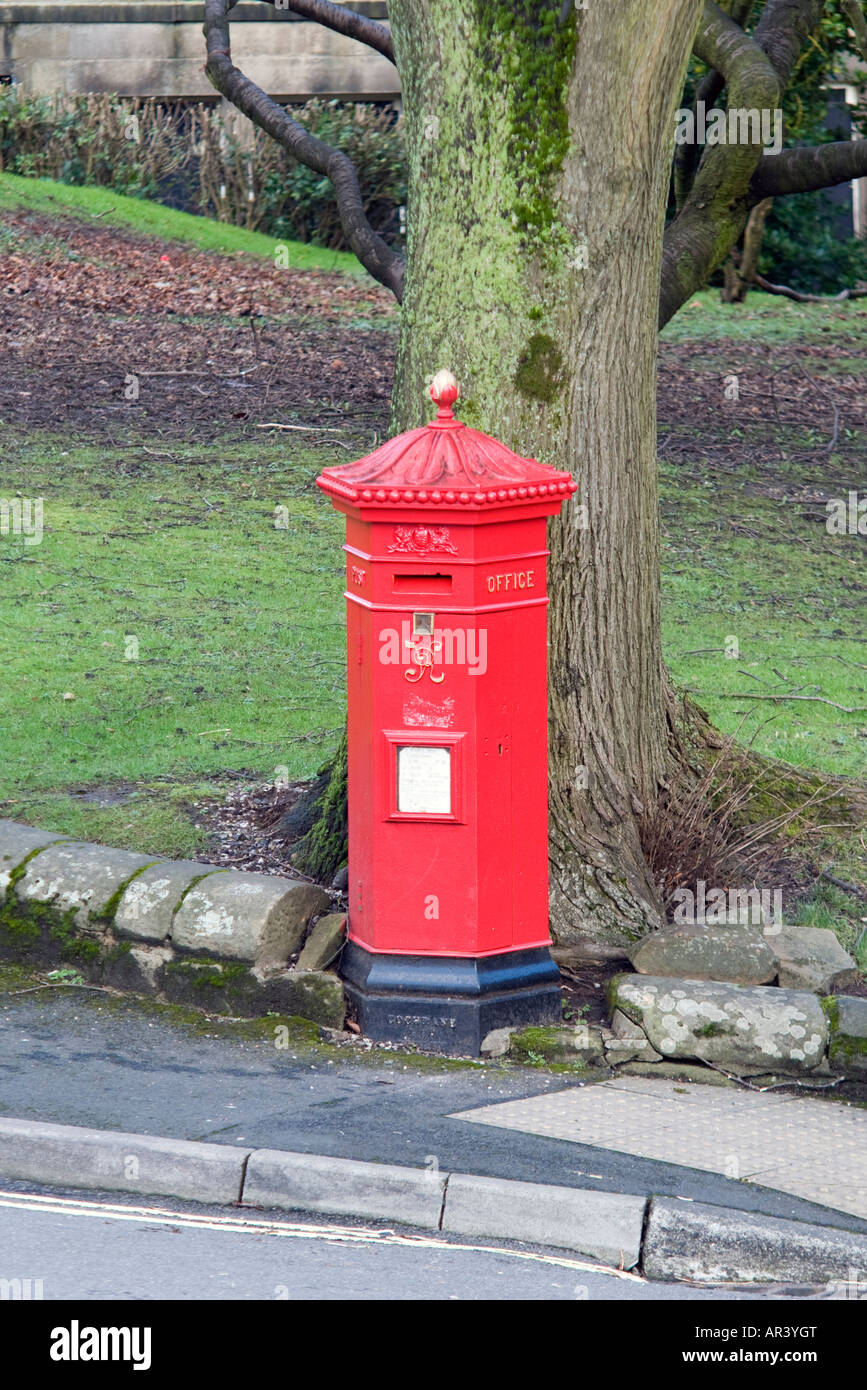 Hexagonal red mail Victorian post box in Buxton Derbyshire 'Great Britain' Stock Photo