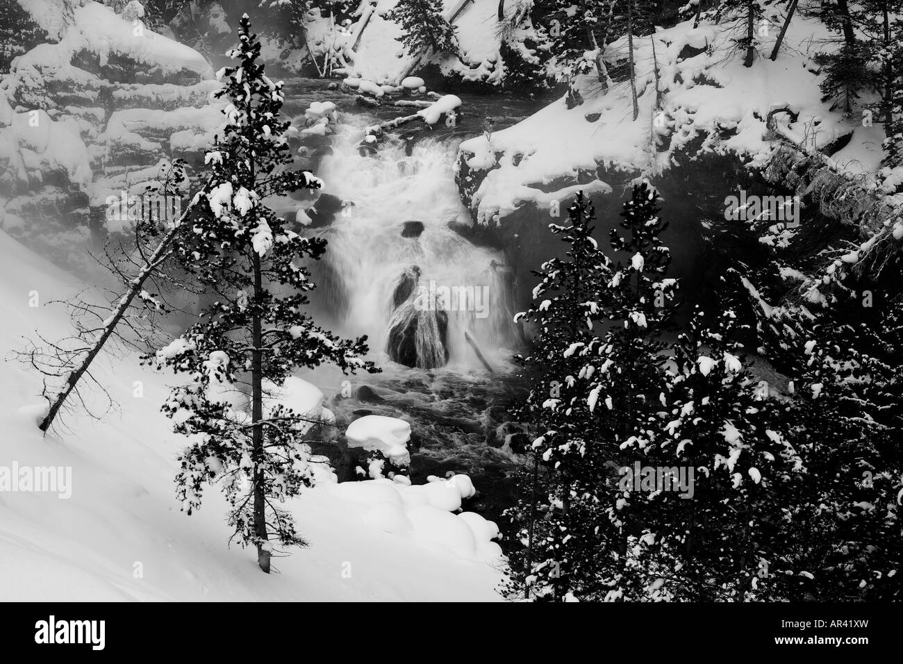 Yellowstone National Park Madison River waterfall rapids in winter snow and ice Stock Photo
