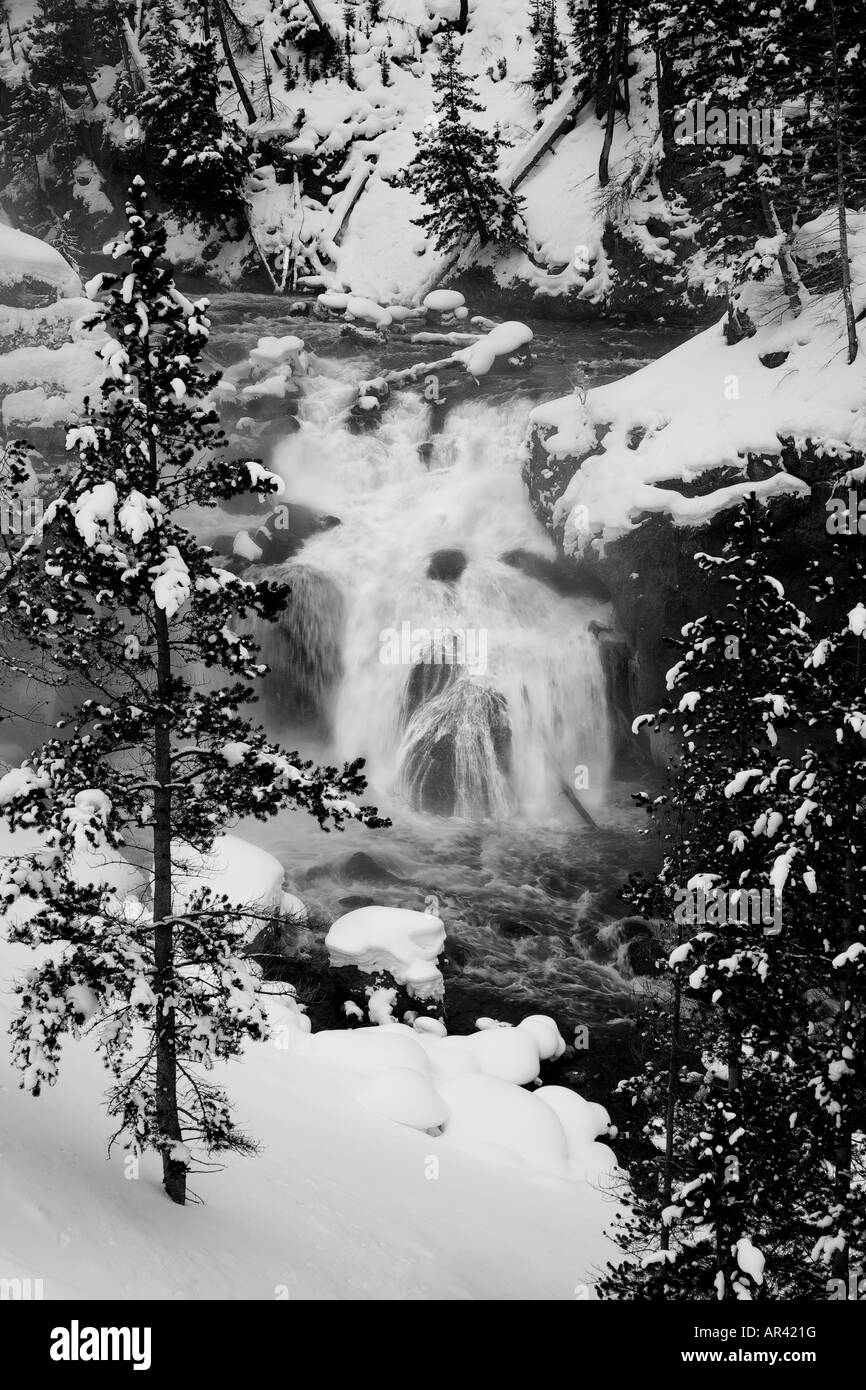 Yellowstone National Park Madison River waterfall rapids in winter snow and ice Stock Photo