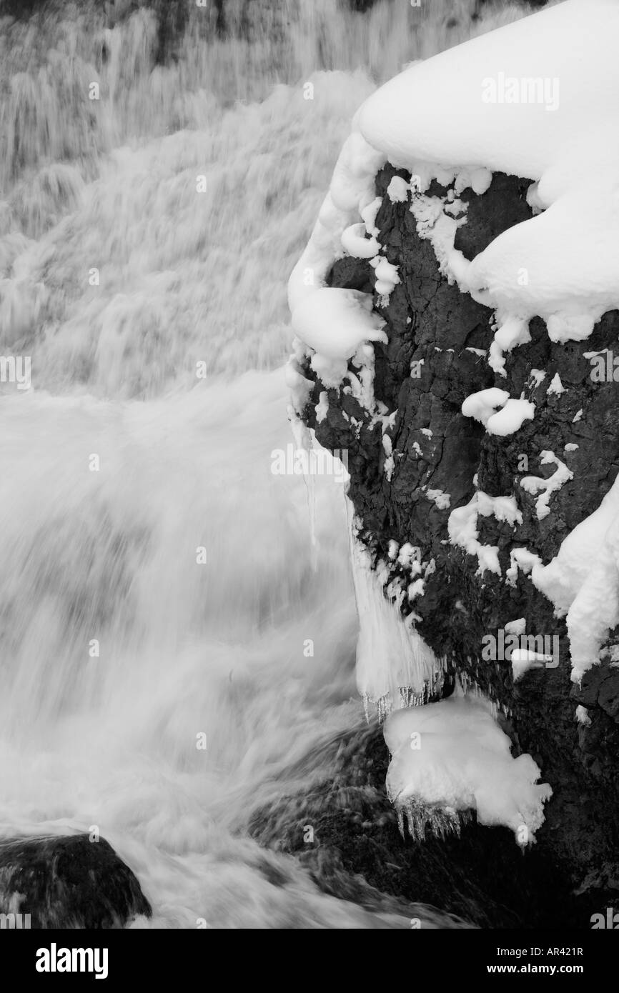 Yellowstone National Park Madison River waterfall rapids in winter snow and ice Stock Photo