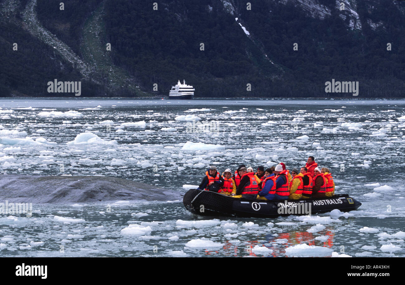 Passengers and MV Mare Australis in Chilean fjords south america near Pia Glacier Stock Photo