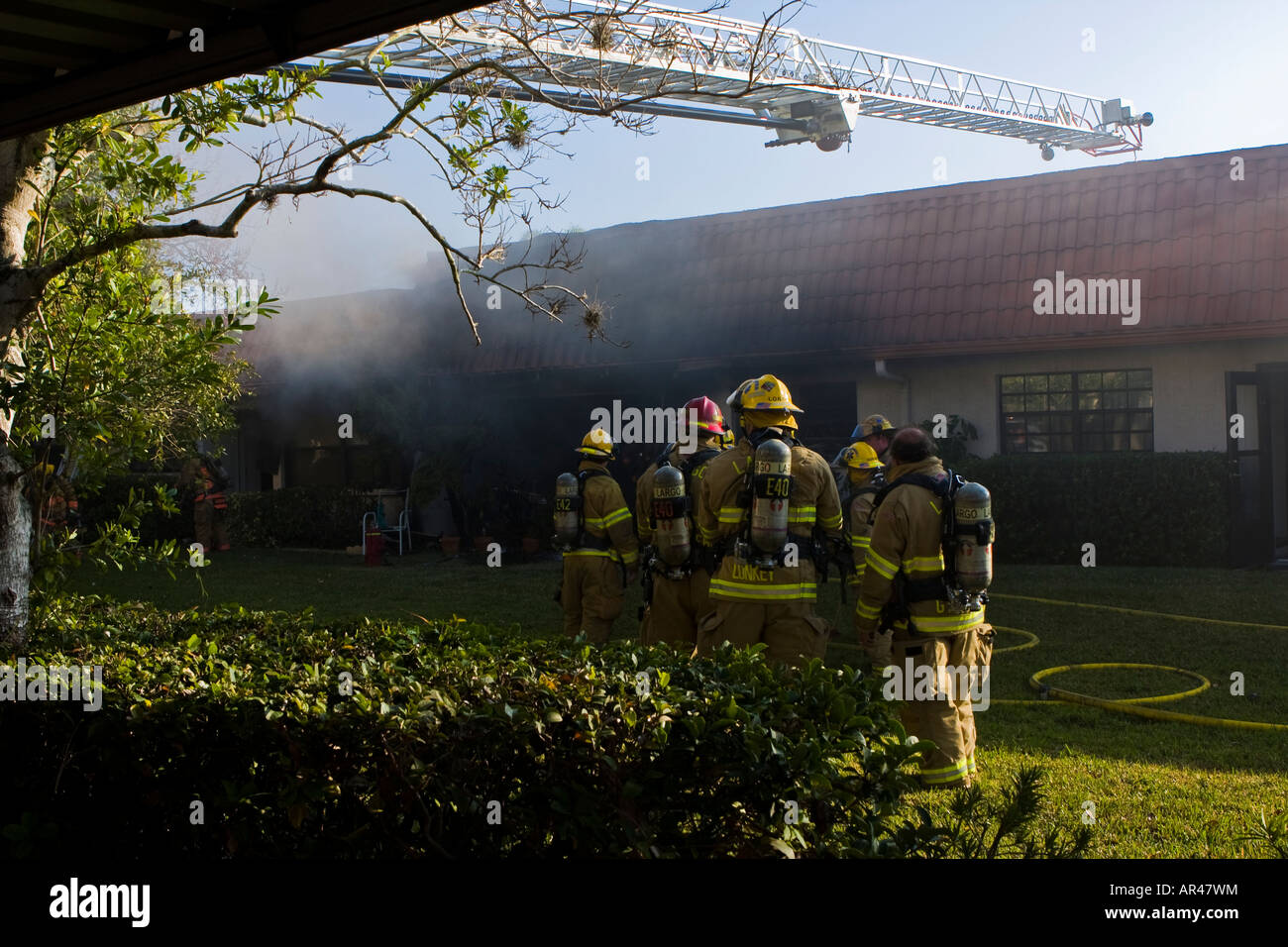 Firefighters at Apartment Fire Stock Photo Alamy