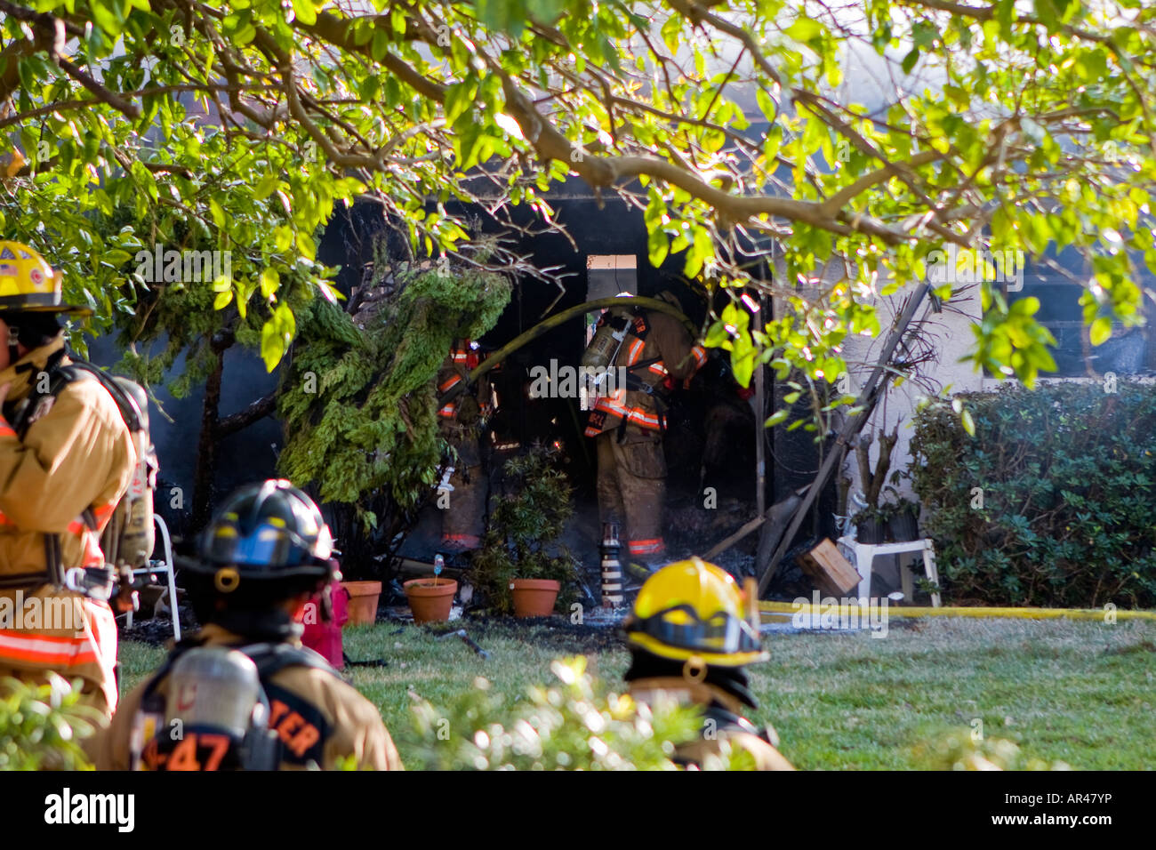 Firefighters at Apartment Fire Stock Photo Alamy