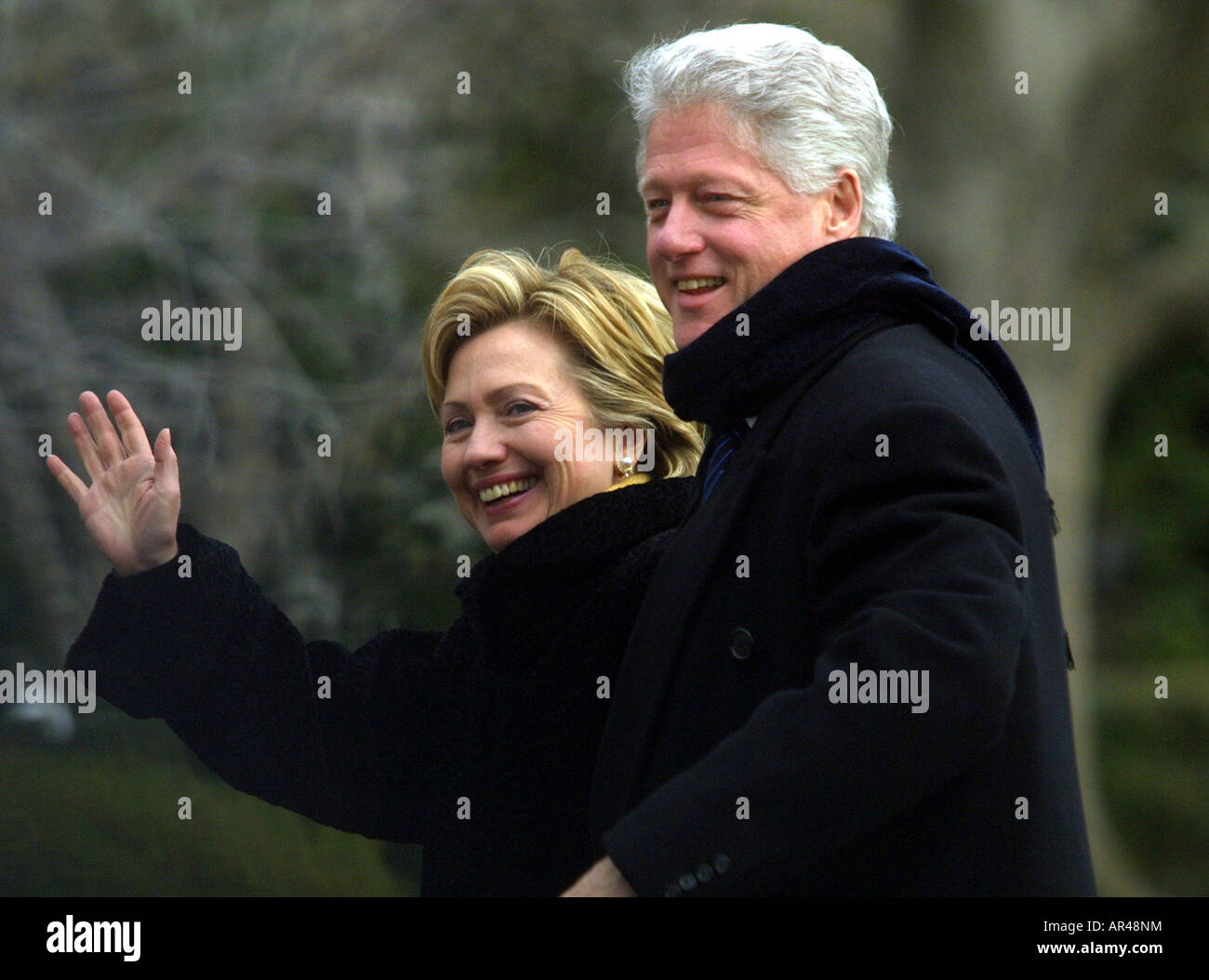 Senator Hillary Rodham Clinton and President Clinton arrive at the White House and wave to press Stock Photo