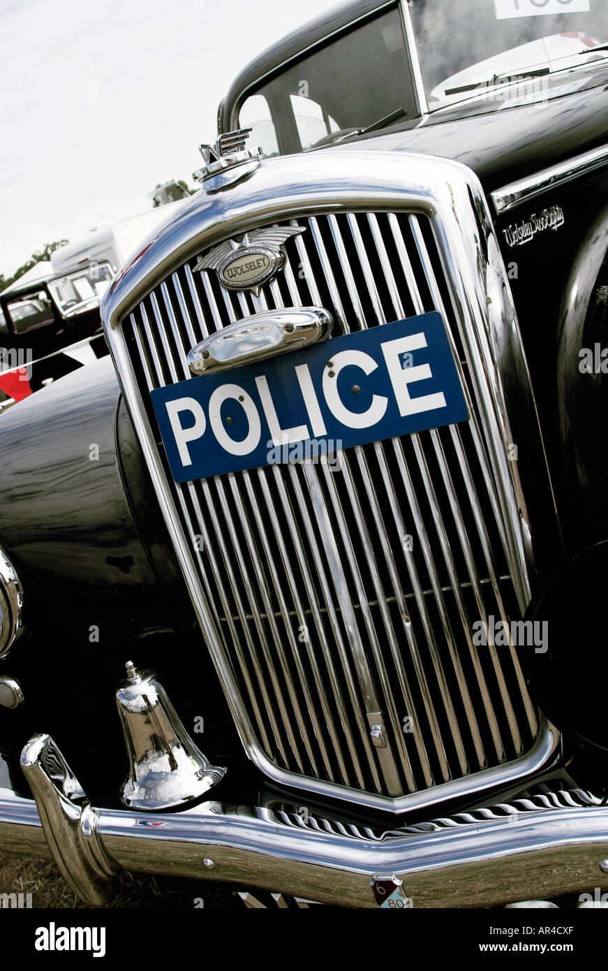 The front of a Wolesley six eighty police car showing the police badge and headlights Stock Photo