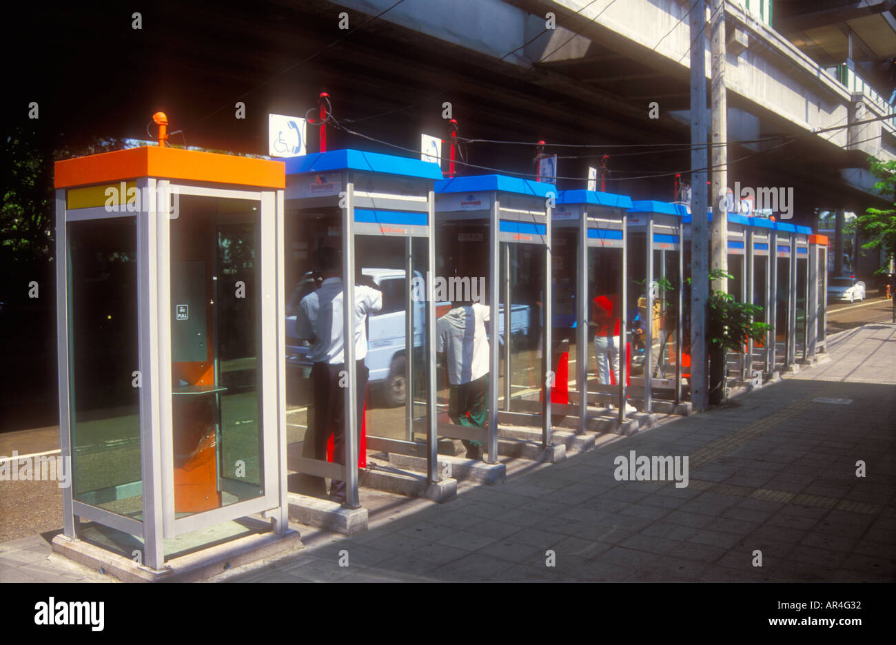 A row of public phone booths on Sukhumvit Road, Bangkok, Thailand Stock Photo