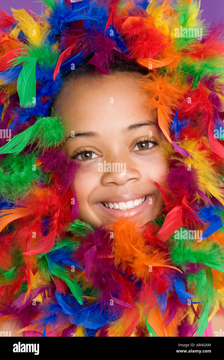 Girl with feathers around her face Stock Photo