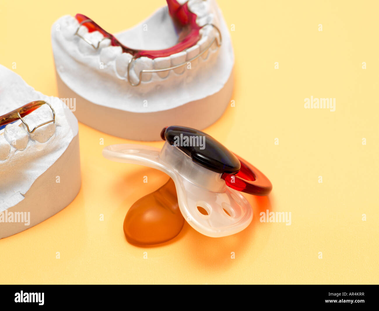 Pacifier and braces Stock Photo Alamy