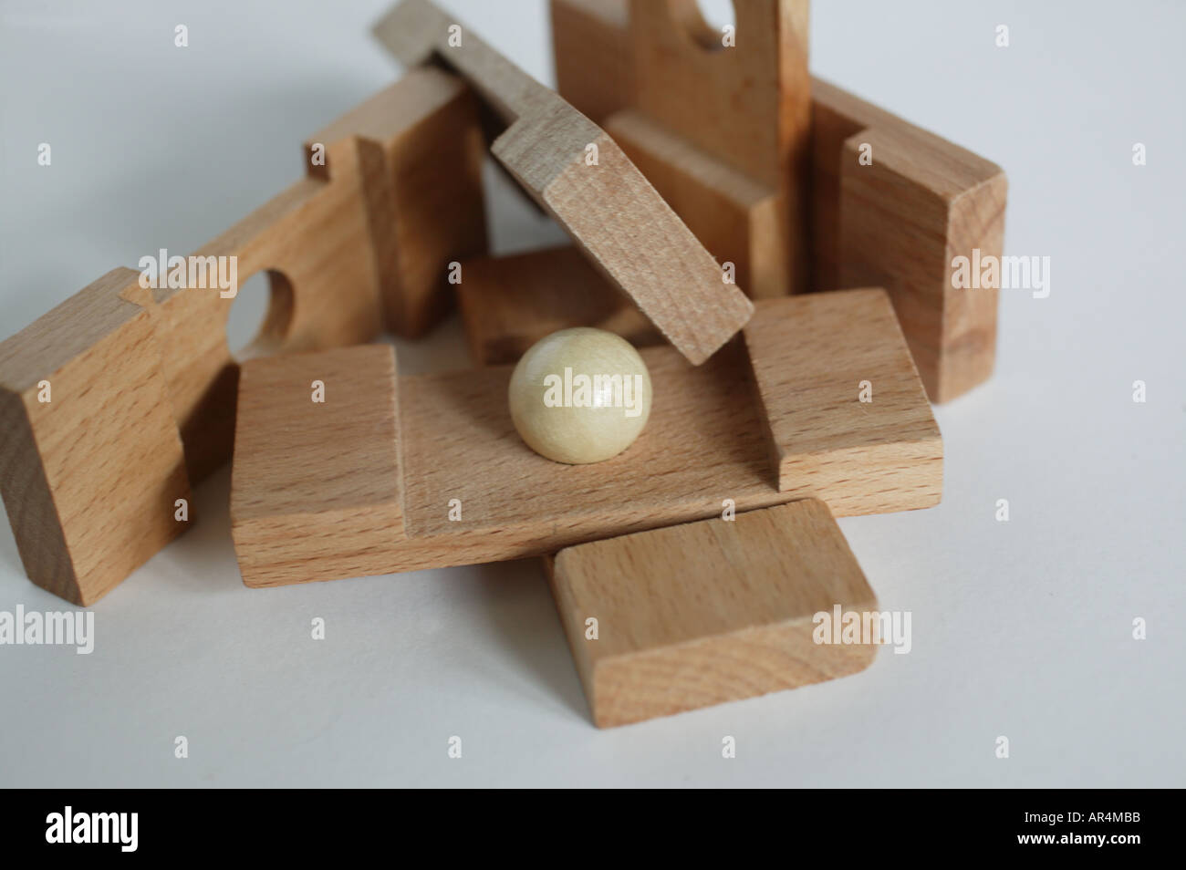 close up of wooden game pieces with white ball Stock Photo Alamy