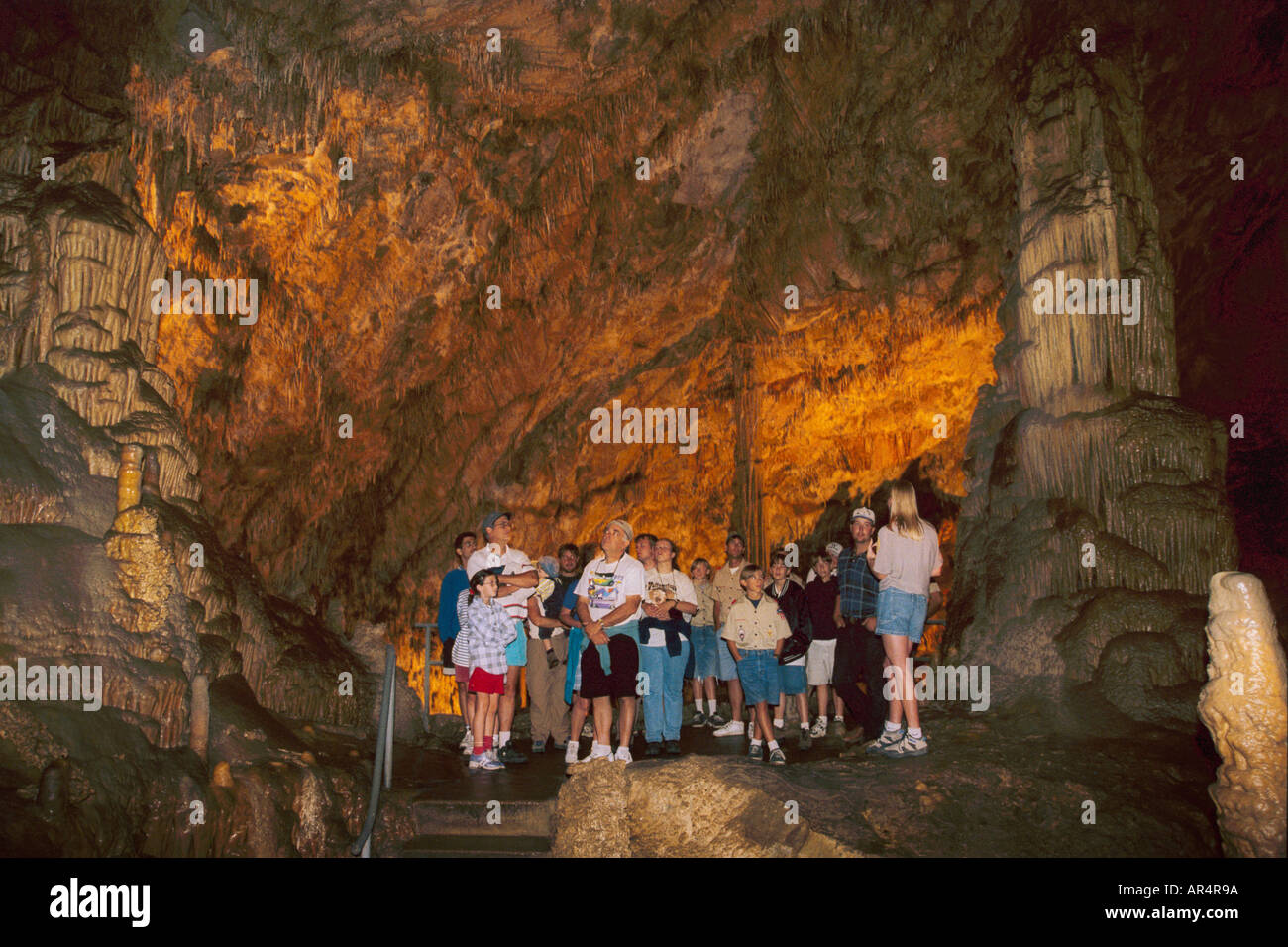 Lewis Clark Caverns State Park Montana woman guide leading group on tour of cave Stock Photo