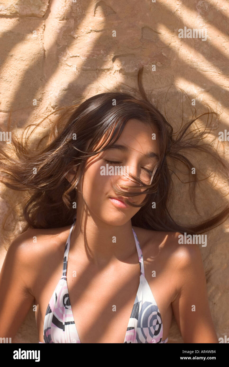Portrait of Teenage Girl 13 14 Wearing Bikini in Dappled Shade Stock Photo  - Alamy