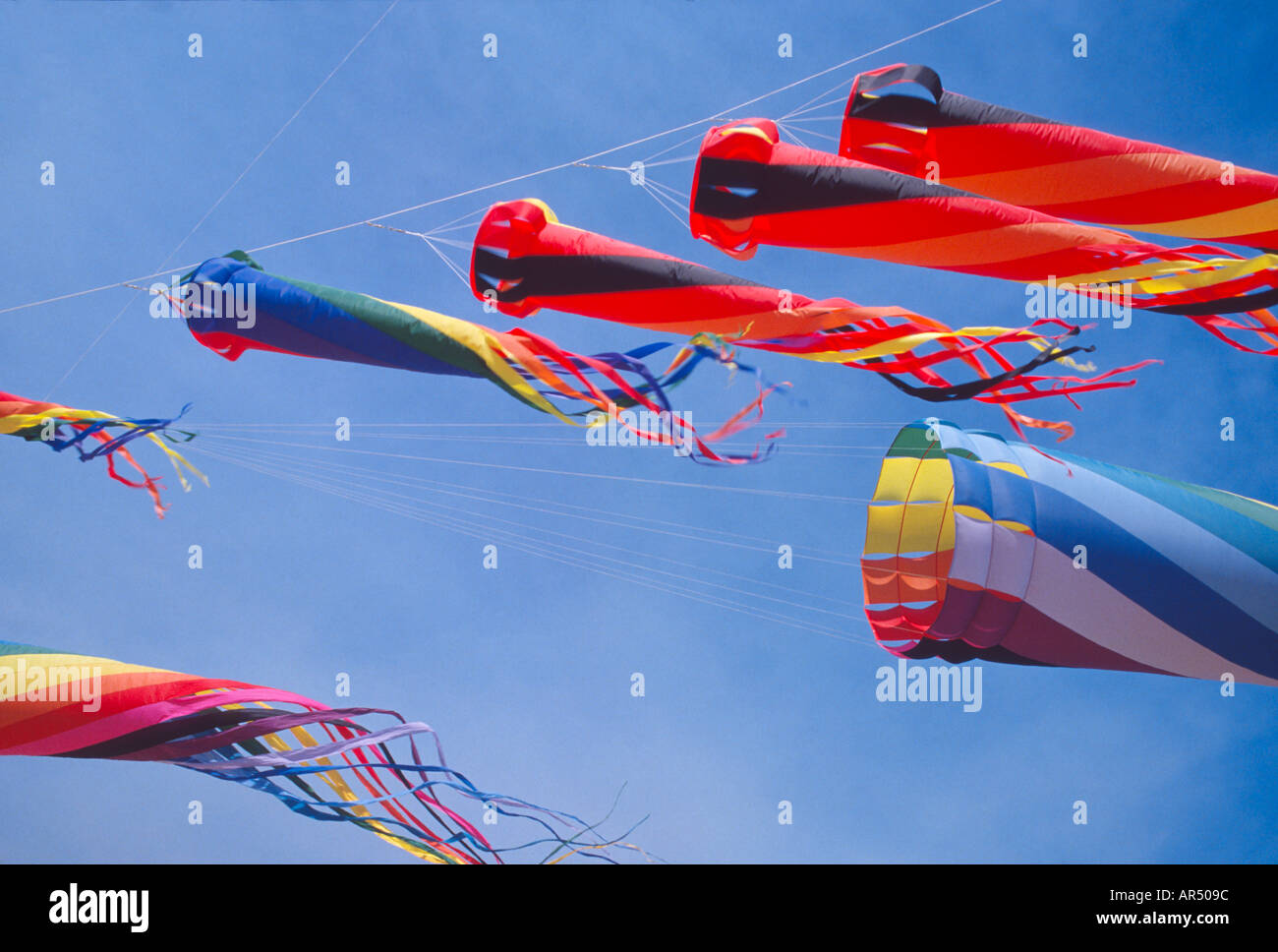 group of spinning windsocks in flight supported by parafoil kite