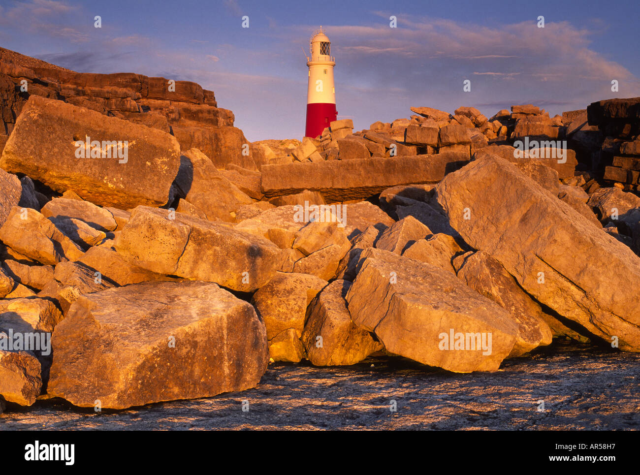 Portland Bill lighthouse and rocks lit by the warmth of the setting sun in  Dorset county England UK Stock Photo - Alamy