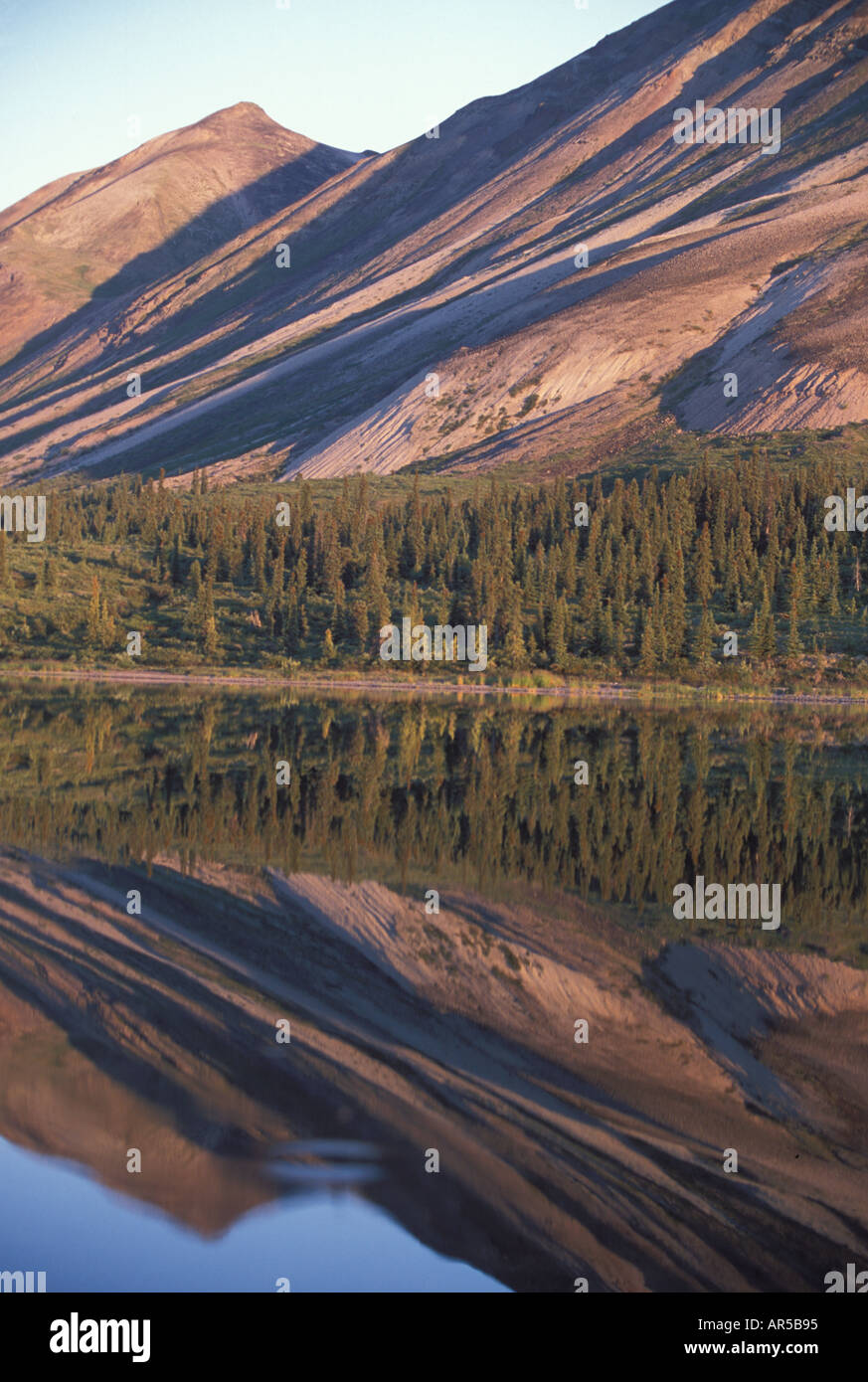 Chigmit Mountains reflection in Twin Lakes rocky slopes eroding